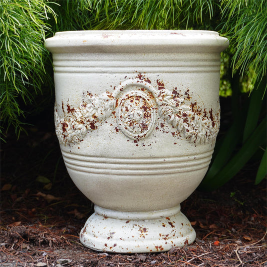 Classic French Garland Urn with decorative garland motif and aged finish