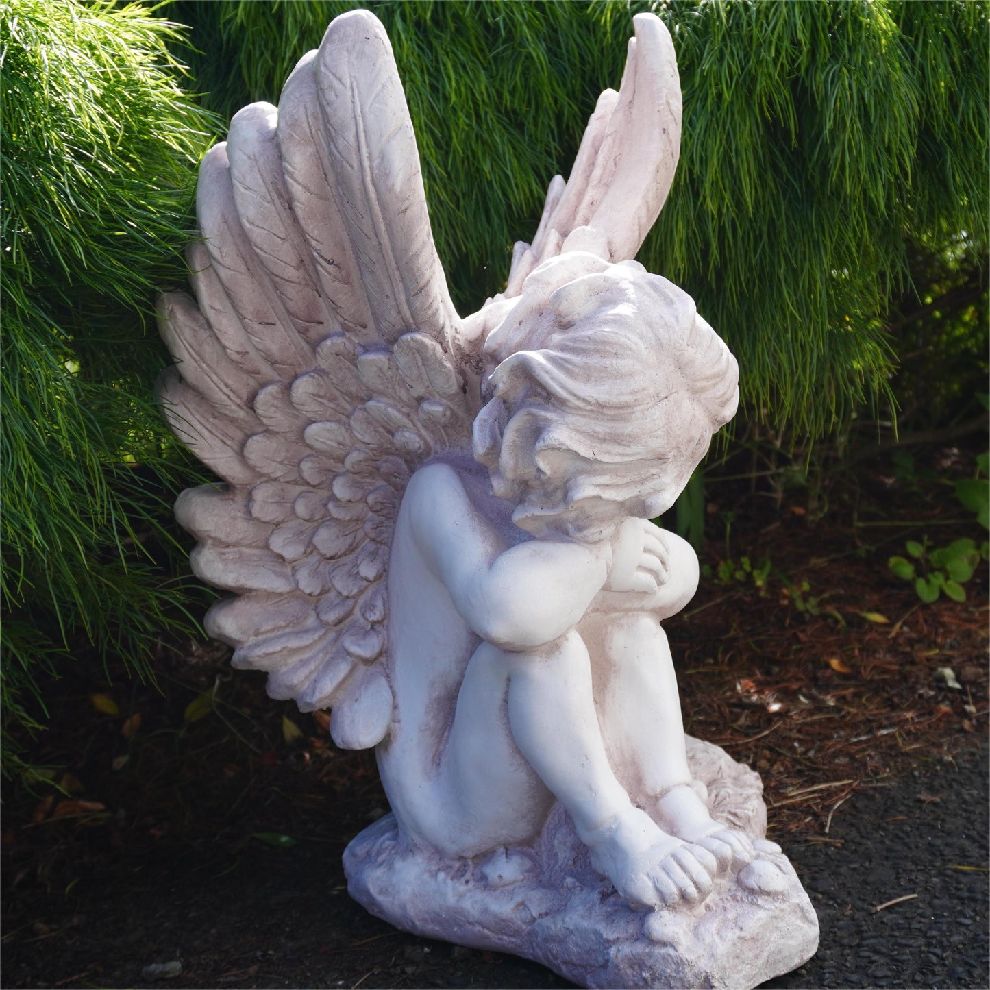 back view of resting angel statue